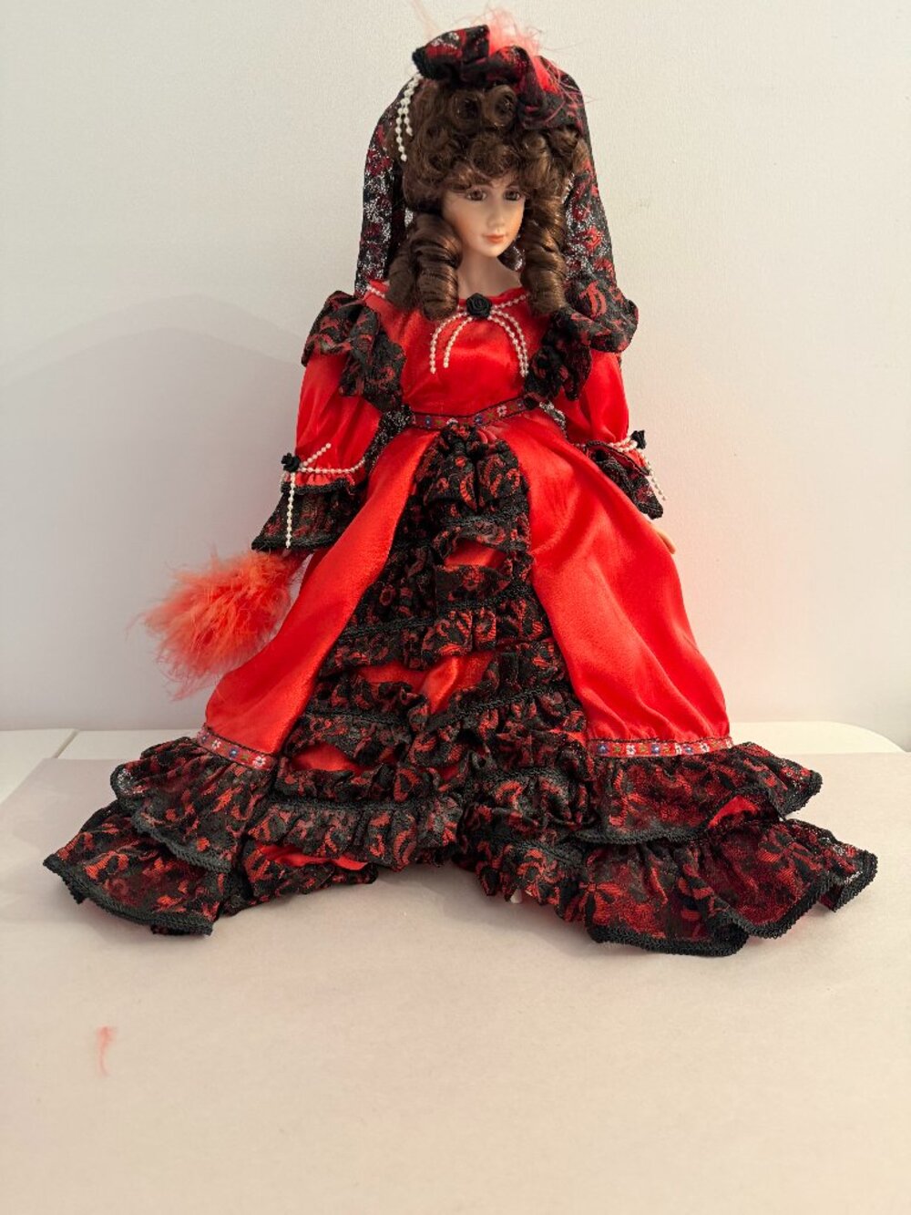 Vintage Porcelain Doll in Red and Black Dress